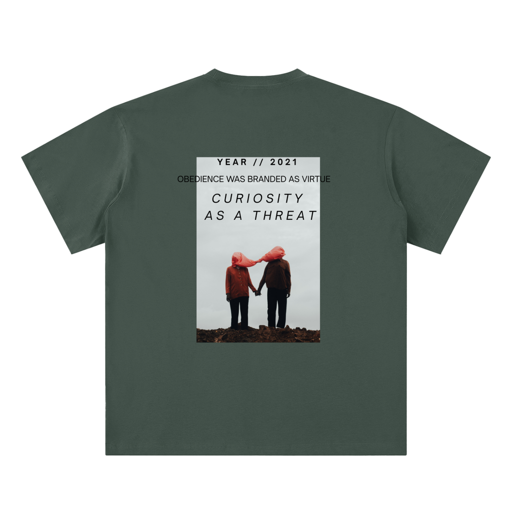 pandemic t-shirt back view in green featuring Year 2021 graphic with obedience and curiosity text